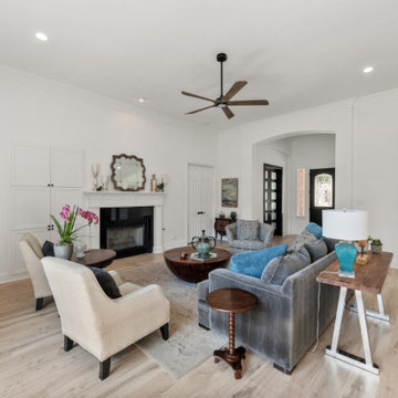 Modern Family Room Remodel with Bright White Walls and Light Flooring