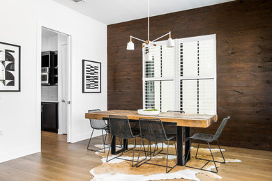 Example of a mid-sized cottage medium tone wood floor and beige floor kitchen/dining room combo design in Austin with multicolored walls