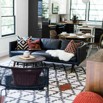 Moroccan Inspired Room with Licorice Leather Sofa, Red Pouf and West Elm Layla R