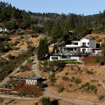 A little farm below a hillside resort-style off-the-grid view home