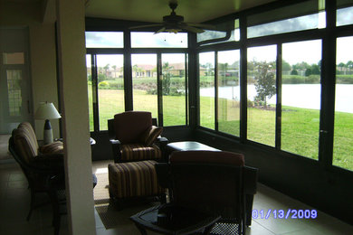 Large traditional sunroom in Orlando with ceramic floors, no fireplace and a standard ceiling.