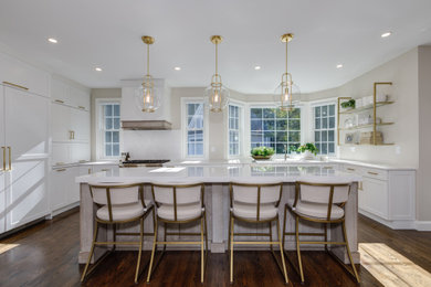 Inspiration for a kitchen remodel in Boston with shaker cabinets, yellow cabinets, quartzite countertops and an island