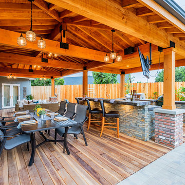 Stacked Stone outdoor kitchen and BBQ with seating area