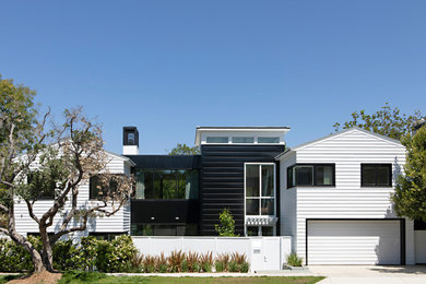 Photo of a contemporary two-storey multi-coloured house exterior in Los Angeles with a gable roof.