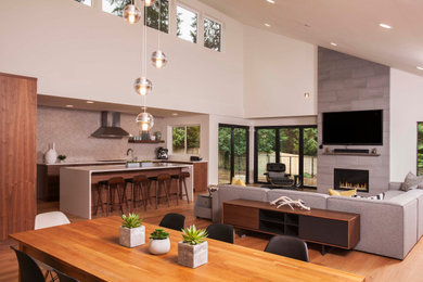 Inspiration for a large midcentury open plan dining in Seattle with white walls, medium hardwood floors, a standard fireplace, a tile fireplace surround and brown floor.