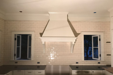 Example of a huge u-shaped eat-in kitchen design in Atlanta with ceramic backsplash and an island