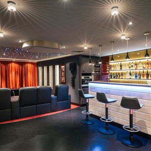 Home theater - large contemporary open concept carpeted home theater idea in Berlin with gray walls and a projector screen