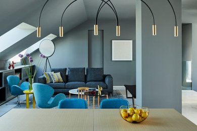 Inspiration for a contemporary open concept marble floor and gray floor living room remodel in Madrid with gray walls