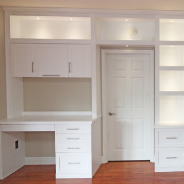 Modern Built-In Entertainment Center along with a Built-in Desk and Cabinetry