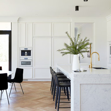 Sleek, White, Quartz-Embellished Kitchen