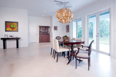 Inspiration for a mid-sized traditional open plan dining in Miami with white walls, limestone floors and white floor.