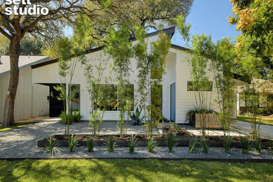 Modern white two-story house exterior idea in Austin