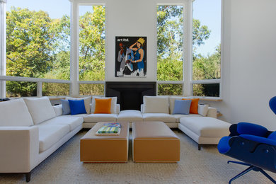 Living room - large contemporary formal and open concept dark wood floor and brown floor living room idea in New York with white walls, a standard fireplace and a stone fireplace