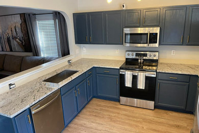 Example of a kitchen design in Raleigh with quartz countertops and multicolored countertops