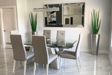 Large minimalist marble floor and white floor dining room photo in Miami with white walls