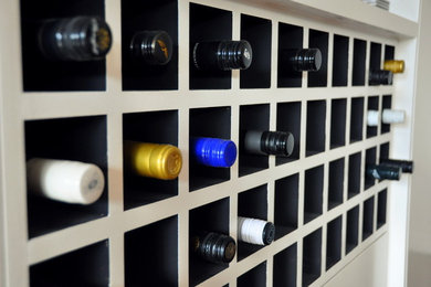 Design ideas for a contemporary wine cellar in Melbourne with storage racks.