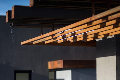 Inspiration for a modern stucco house exterior remodel in Other