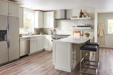 Example of a classic porcelain tile and gray floor kitchen design in Tampa with quartz countertops