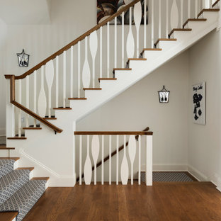 Staircase - large coastal wooden u-shaped wood railing staircase idea in Minneapolis with painted risers