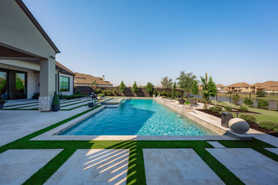 Example of a mid-sized mid-century modern backyard concrete paver and rectangular hot tub design in Houston