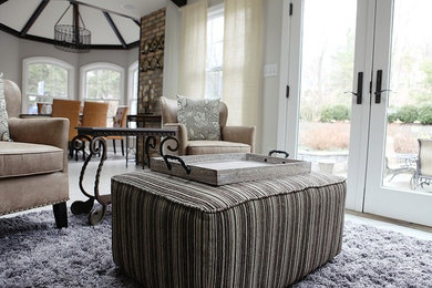 Example of a transitional living room design in New York