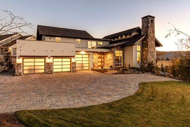 Example of a large minimalist three-story concrete fiberboard house exterior design in Salt Lake City with a green roof