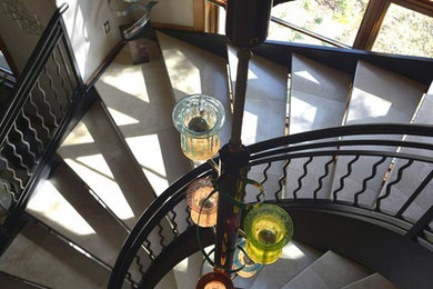 Example of a large trendy tile spiral open and metal railing staircase design in Dallas