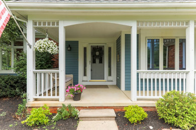 Example of an eclectic two-story exterior home design in Detroit