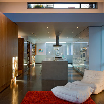 Living room looking into the kitchen, slot to the roof provides connection to th
