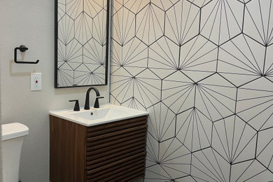 Mid-sized minimalist white tile porcelain tile and black floor bathroom photo in Other with white walls and a floating vanity