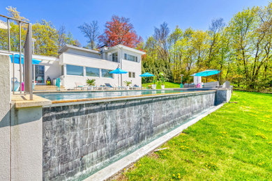Inspiration for a contemporary pool remodel in New York