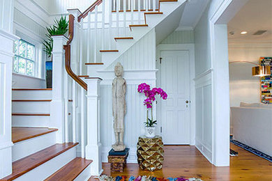 Example of a mid-sized transitional entryway design in New York with gray walls and a dark wood front door