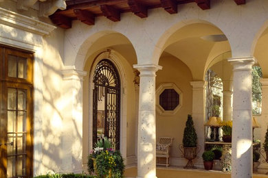 This is an example of a mediterranean entryway in Dallas with a single front door.