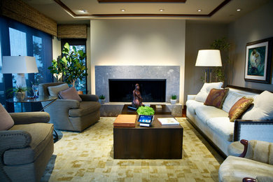 This is an example of a mid-sized tropical enclosed living room in Orange County with a music area, beige walls and medium hardwood floors.