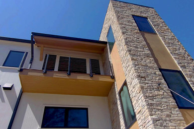 Large contemporary white three-story mixed siding exterior home idea in Boston with a shingle roof and a gray roof