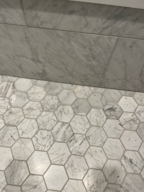 marble shower floor discoloration