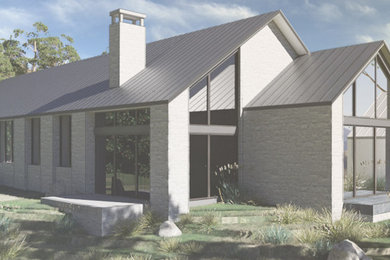 Modelo de fachada de casa gris y gris moderna extra grande de una planta con revestimiento de piedra, tejado a dos aguas y tejado de metal