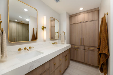 Alcove shower - large modern master brown tile and porcelain tile porcelain tile, white floor and double-sink alcove shower idea in Chicago with flat-panel cabinets, light wood cabinets, a one-piece toilet, white walls, an undermount sink, quartz countertops, a hinged shower door, white countertops, a niche and a built-in vanity