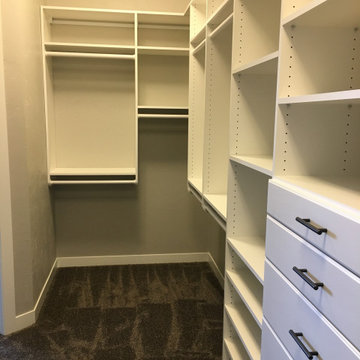 Master closet in white with 96" top shelf