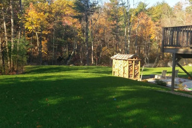 Design ideas for a large rustic partial sun backyard landscaping in Boston.