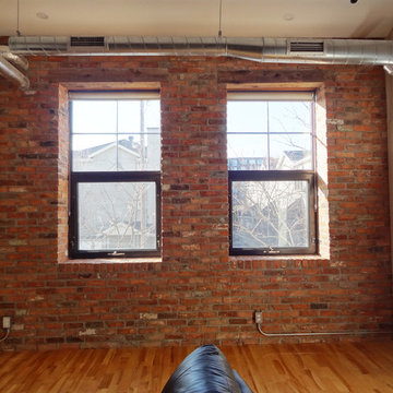 Interior reclaimed brick with barn beam lintels.