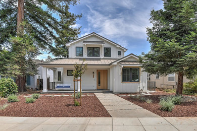 Mid-sized cottage white three-story wood house exterior photo in San Francisco with a metal roof