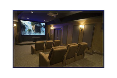 This is an example of a traditional home theatre in Melbourne with brown walls, a built-in media wall and brown floor.