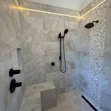 Curd-less walk-in shower; heated floors in bathroom + shower+bench LED