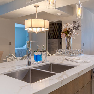 Contemporary Kitchen w/ Gloss Cabinets and Calacatta Natura Quartz Countertops