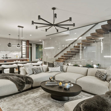 Modern Luxury Lakehouse Open-Concept Living Room with Glass Staircase and Modern
