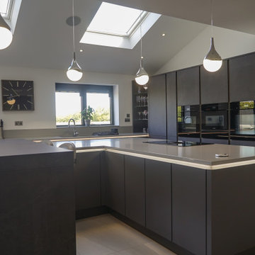 Sleek kitchen for a large executive self build