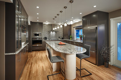Eat-in kitchen - large contemporary u-shaped light wood floor eat-in kitchen idea in Calgary with an undermount sink, flat-panel cabinets, brown cabinets, granite countertops, an island, beige backsplash, glass tile backsplash and stainless steel appliances