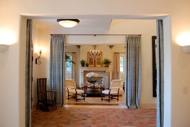 Example of a mid-sized classic formal and open concept living room design in Los Angeles with beige walls, a standard fireplace and a stone fireplace