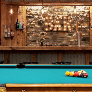 This is an example of a medium sized rustic fully buried basement in Philadelphia with brown walls, concrete flooring and beige floors.